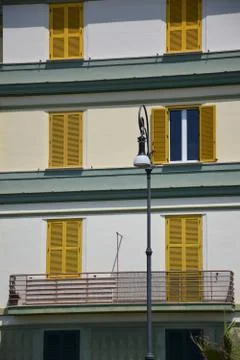 Yellow window shutters Stock Photos
