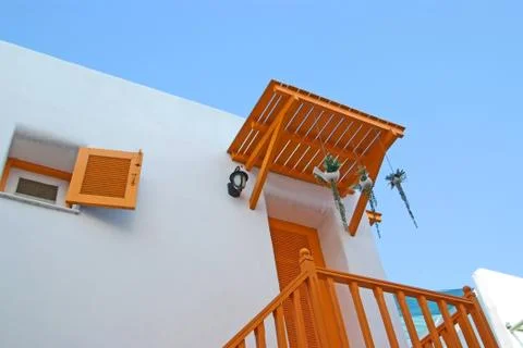 Yellow window on the white wall Foto stock
