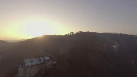 Yellow Winter Sun Behind isolated 11th century Castle tower, 4K Stock Footage 72928701