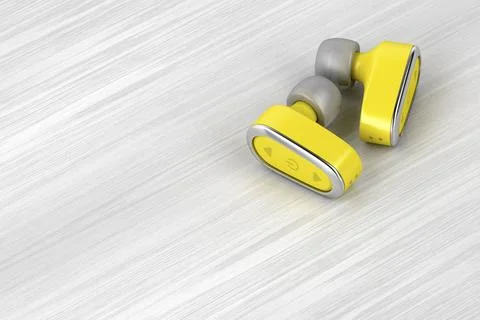 Yellow wireless headphones Yellow wireless in-ear headphones on wood table... Stock Photos