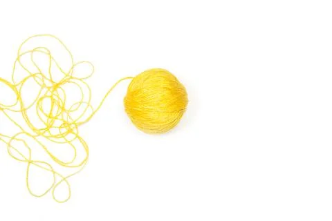 Yellow wool ball on a white background with copy space Foto stock