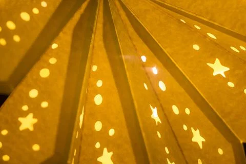 Yellow xmas lantern star pattern at christmas market season. Shiny star mood  Stock Photos