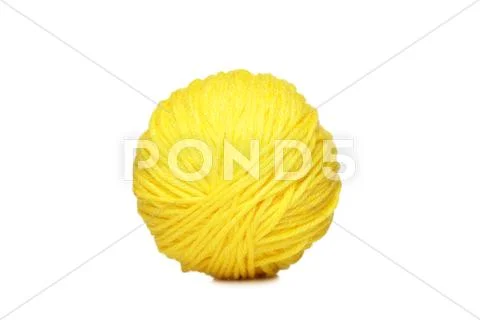 Yellow yarn ball over white Stock Photos