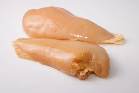 Yellowish chicken breasts Stock Photos