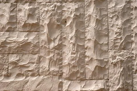 Yellowish stone or plaster surface, illuminated by natural sunlight, suitab.. Stock Photos