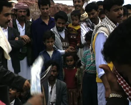 YEMEN ritual dance and people watching Stock Footage