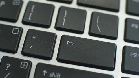 Yes button on computer keyboard, female hand fingers press key Stock Footage 97827974