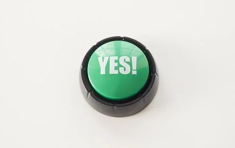 Yes text on green round button, top view of key to press with finger and choose Stock Photos