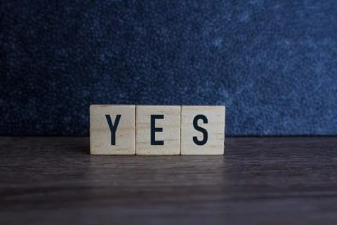 YES , on wood cube Stock Photos