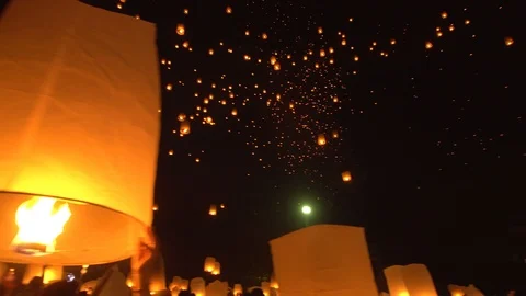 Yi Peng Lanna lanterns floating to night sky. Stock Footage 100004270