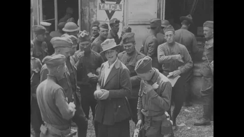 Y.M.C.A. workers distribute newspapers to troops during World War I, 1918 Stock Footage 124083076