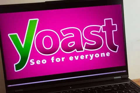 Yoast SEO search engine optimization plug-in logo on laptop Stock Photos
