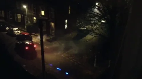 Yobs launch firework attack drive-by on Leeds side street Vídeos de archivo 105830479