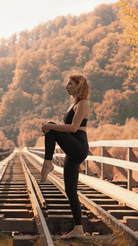 Yoga asanas in nature help to keep the body in shape and expand consciousness Stock Footage 284714265