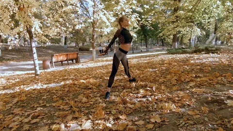 Yoga in the autumn park Stock Footage
