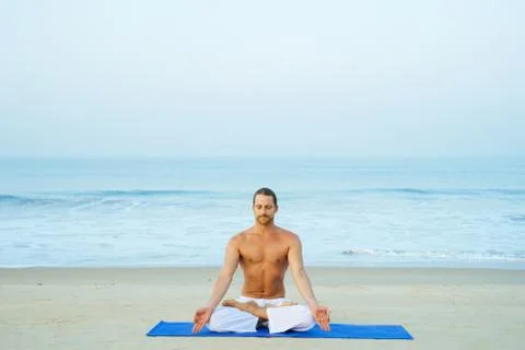 Yoga on the beach 스톡 사진