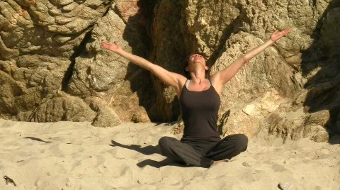 Yoga on the beach V2 - HD Stock Footage 778575