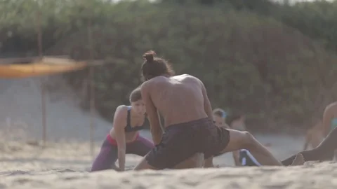 Yoga class on the beach Stock Footage 73917985