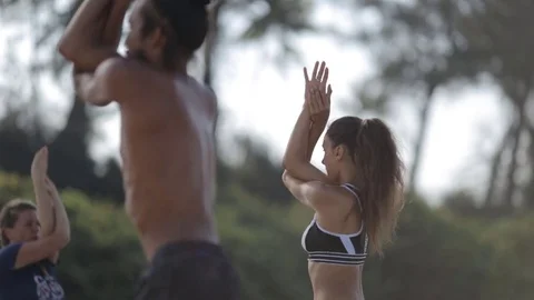 Yoga class on the beach Stock Footage 73918043