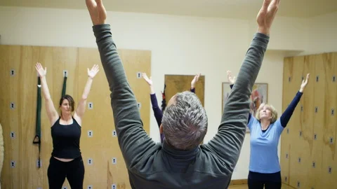 Yoga Class Instructor Old People Fitness Exercise Healthy Lifestyle 4K Stock Footage 104659675