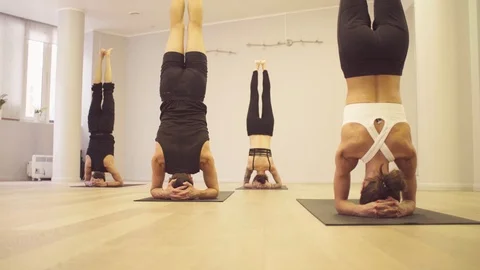 Yoga class. People doing yoga exercises Stock Footage 88735657