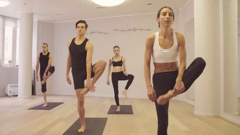Yoga class. People practicing yoga in the studio 스톡 동영상 88831008