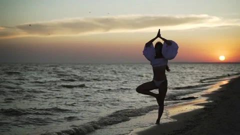 Yoga classes on the sandy beach in summer Stock Footage 160414616