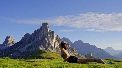 Yoga Cobra pose in the mountains Stock Footage 256166024