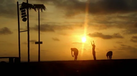 Yoga during sunset on a beach Stock Footage 64075066
