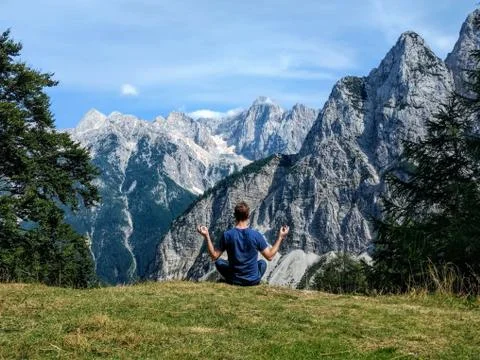 Yoga on the edge, on the Vrsic Pass in Slovenia Stock Photos