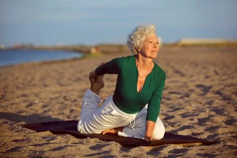 Yoga exercise on the beach Foto stock