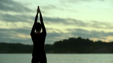 Yoga; exercise; breathing; stretching; shoulder; grasping; hands; workout; ou Stock Footage 137053101