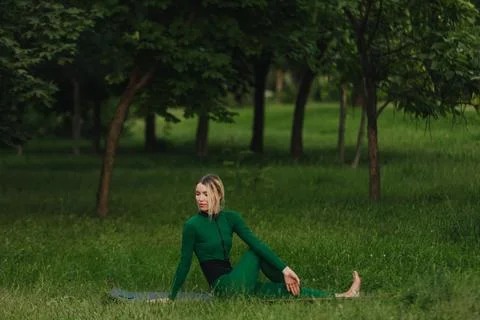 Yoga on the grass. Stock Photos