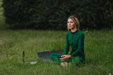 Yoga on the grass. Stock Photos
