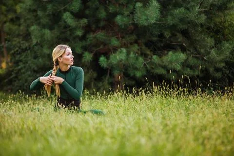 Yoga on the grass. Stock Photos