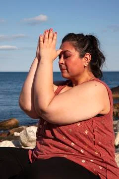 Yoga hands to forehead Stock Photos