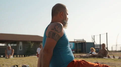 Yoga Instructor Conducts a Master Class on Yoga For a Group of People at the Stock Footage 61265598