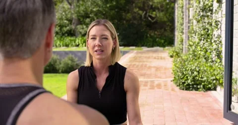 Yoga instructor giving calming remarks and guiding breathing exercise on brick Stock Footage 339590710