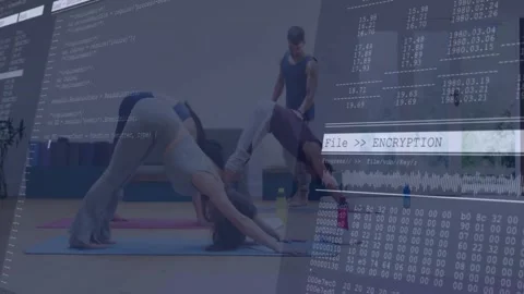 Yoga instructor guiding class in technology studio, showing code snippets, Stock Footage 327524812