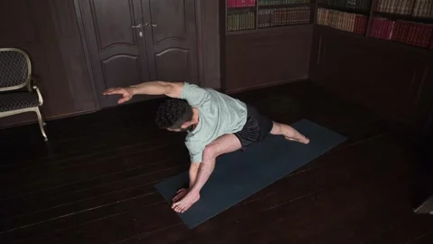 Yoga Instructor Is Performing Yoga. Attractive Man Making Yoga Pose. Stock Footage 152570933
