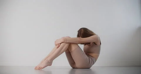 Yoga instructor performs stretching exercises in slow motion, young woman in Stock Footage 147460301