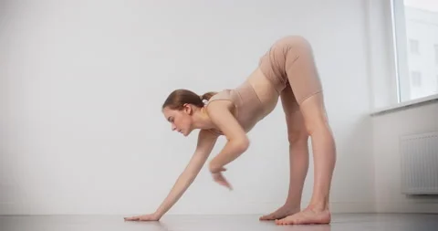 Yoga instructor performs stretching exercises in slow motion, gymnastic woman Stock Footage 148054541