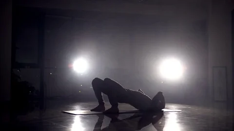 Yoga instructor shows flexible exercise in a gym Stock Footage 72557972