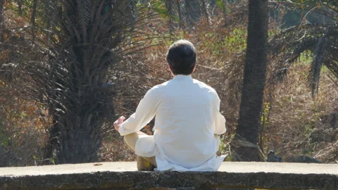 A yoga man does an asana on a bridge 스톡 동영상 237468060