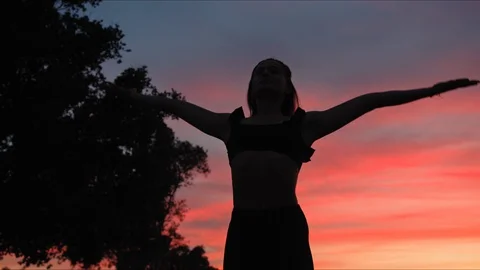 Yoga master doing yoga session at park, beautiful sunset Stock Footage 129999798