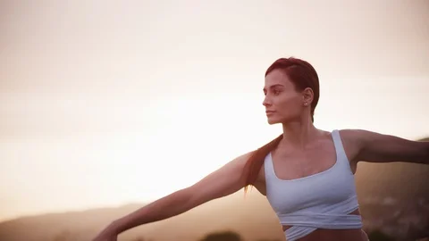 Yoga master doing yoga session at park, backlit sunlight Stock Footage 130051262