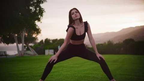 Yoga master doing yoga session at park Stock Footage 130051627