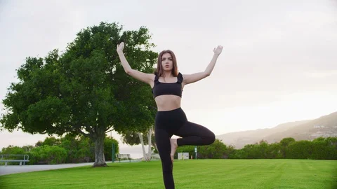 Yoga master doing yoga session at park Stock Footage 130051975