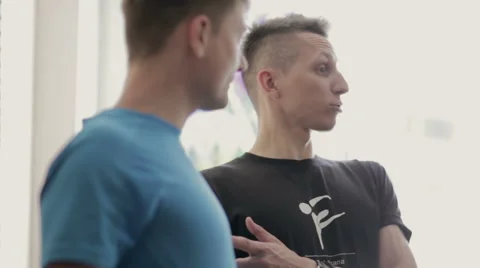 Yoga Master shows how to do the exercise Stock Footage 64809528