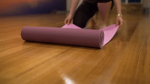 A yoga matt rolling out Video stock 90208342